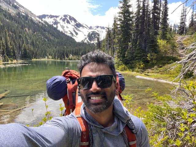 Vivin hiking at a mountain lake